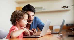 parent and child together enjoying computer time